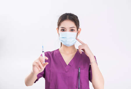 female nurse in purple nurse uniform