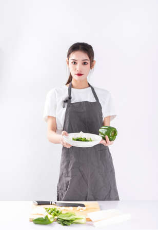 woman holding vegetablesの写真素材