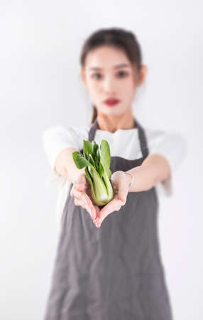 woman holding vegetablesの写真素材