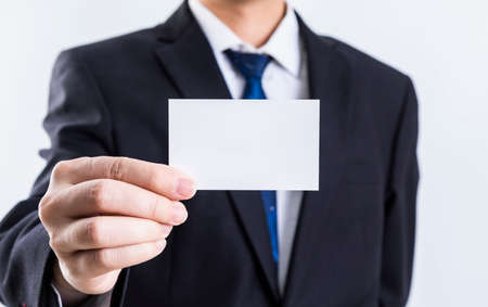 Business people holding blank cardsの写真素材