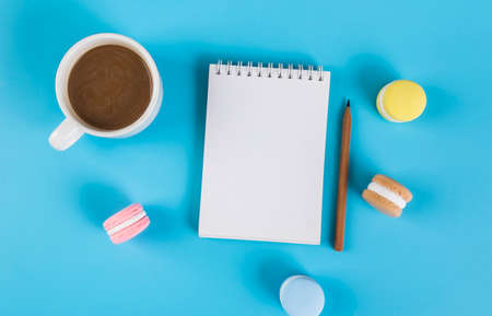 Macaron cake and blank notebookの写真素材