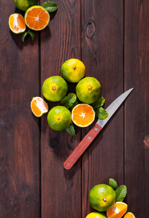 Fresh citrus fruits on wooden table. Top view with copy space.の写真素材