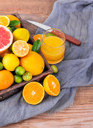 Citrus fruits on a wooden background. Grapefruit, orange, lemon and lime.の写真素材