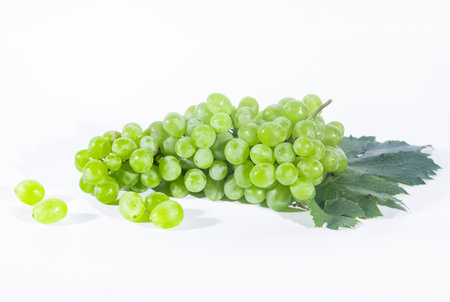Green grapes on white background. Isolated on a white background.の写真素材