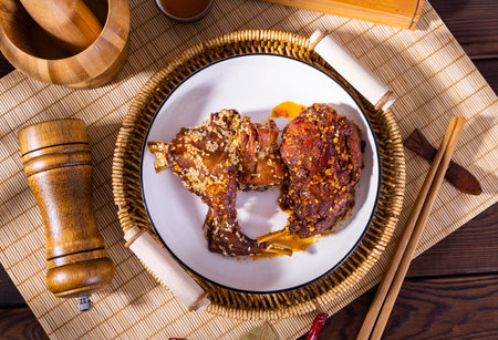 Baked pork ribs with honey and spices on a wooden background.の写真素材
