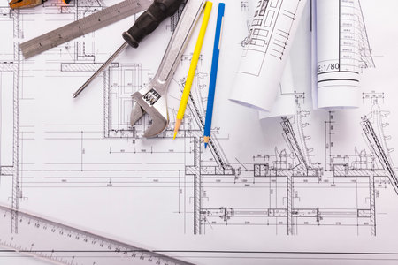 Architectural plans and tools on the table of the engineer.の写真素材