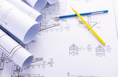 Architectural project with blueprints and pencils. Architect workplaceの写真素材