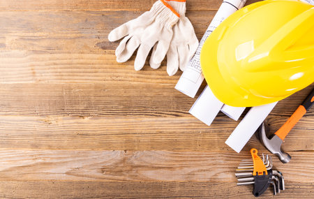 Standard construction safety equipment on wooden background. Copy space for text.の写真素材