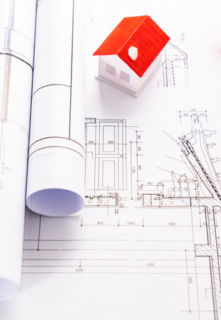 House model and blueprints on construction site. Architectural project.の写真素材