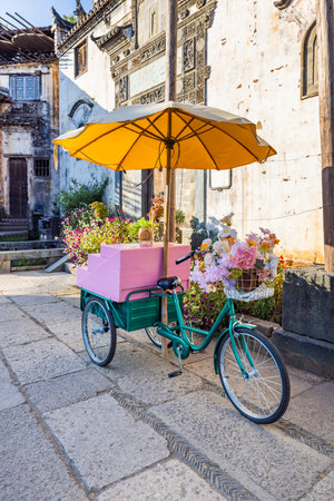 Bicycle with flowers in the old town of Hanoi, Vietnamの写真素材