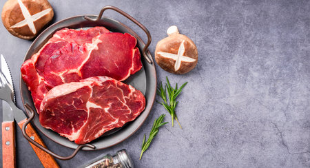 Raw ribeye steak. Raw meat. Top view with copy spaceの写真素材