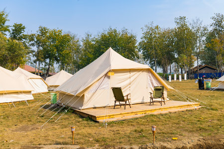 Camping tents on the lawn in the park in the summer.の写真素材