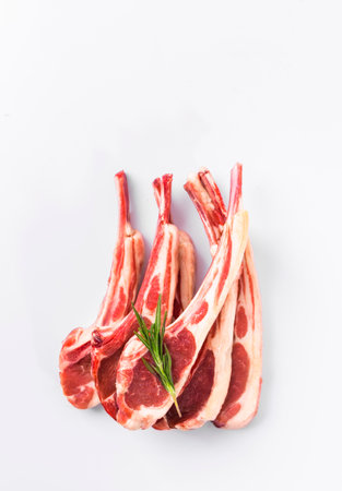 Raw lamb chops isolated on white background. Top view. Flat layの写真素材