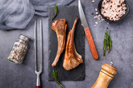 Grilled lamb chops with rosemary, salt and pepper. Top viewの写真素材