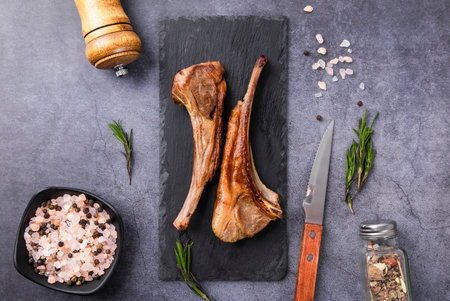 Grilled lamb chops with rosemary, salt and spices. Top viewの写真素材