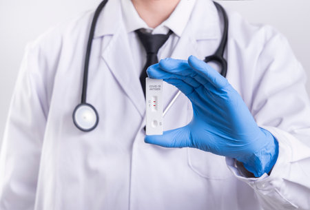 Doctor holding a negative result of coronavirus COVID-19 testの写真素材