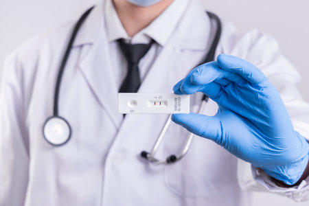 Doctor holding negative test result for coronavirus COVID-19の写真素材
