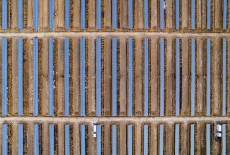 Aerial view of old rusty metal grid with blue and white stripesの写真素材