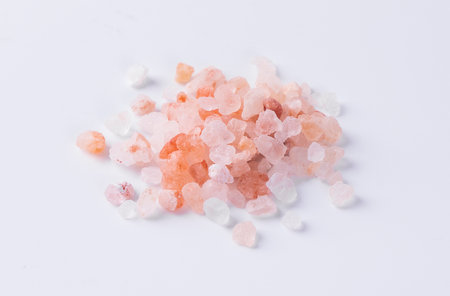 Himalayan pink salt isolated on white background. Selective focus.の写真素材