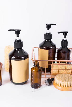 Set of cosmetic bottles with dispenser on white background. Shallow dof.の写真素材