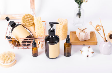Spa and beauty products on a white background. Massage brush, shower gel, oil, soap, bath salt and...