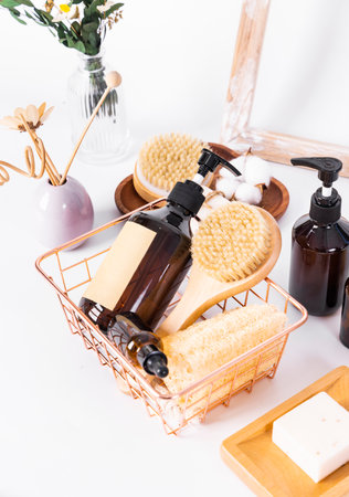 Spa still life with soap, massage brush and shampoo on white backgroundの写真素材