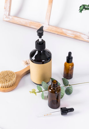 Essential oil and serum in glass bottles on a white background.の写真素材