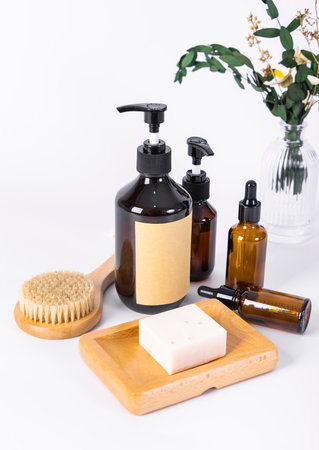 Spa and body care products on a white background. Soap, shampoo, soap, massage brush.の写真素材