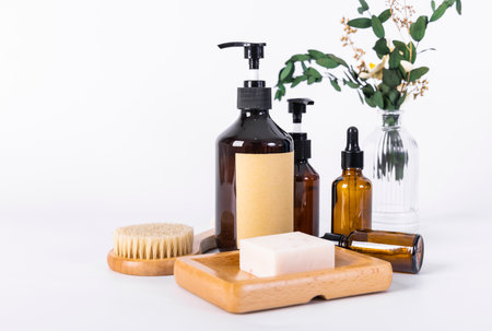 Spa and body care products on a white background. Massage brushes, soap, shampoo.の写真素材