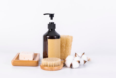 Set of bath accessories on white background. Shower gel, shampoo, soap, sponge and cottonの写真素材