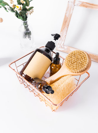 Bath accessories in a basket on a white background. Spa conceptの写真素材