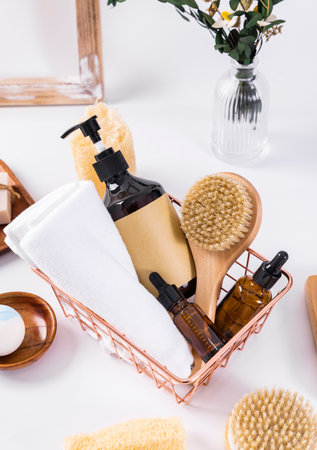 Spa set on white background. Massage brush, shampoo, bath salt, soap, towel, oil.の写真素材