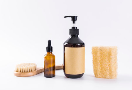 Set of cosmetic products on a white background. Shower gel, soap, shampoo, massage brush.の写真素材