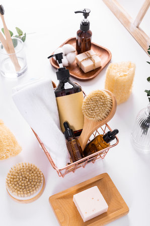Spa still life on a white background. Body care products in a basket.の写真素材