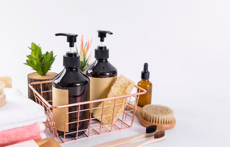 Bath accessories and toiletries on a white background. Shower gel, soap, shampoo, toothbrush, towel, brush.の写真素材