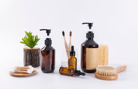 Bath accessories on a white background. Shower gel, soap, shower gel, wooden toothbrushes.の写真素材