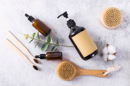 Eco friendly bamboo toothbrushes, bottles of body care products.の写真素材