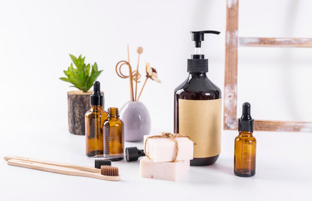 Eco-friendly bamboo toothbrushes, glass bottles with liquid soap, zero waste conceptの写真素材