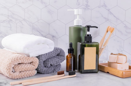 Bathroom interior with towels, soap, shampoo and other accessories.の写真素材
