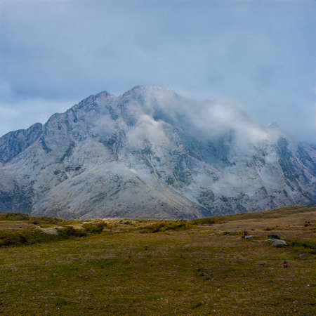 AI generated snow mountain under cloudy sky