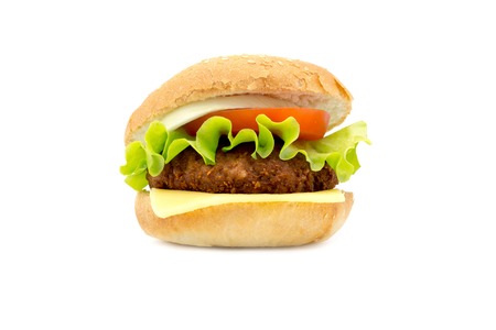 hamburger with fresh leaf lettuce cheese slice chop tomatoes and onion rings isolated on white backgroundの写真素材