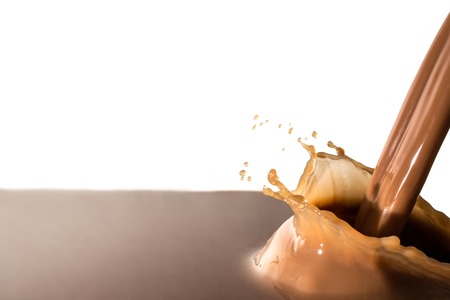 Splash of chocolate, pouring stream of chocolate, cocoa, isolated on white backgroundの写真素材