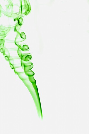 Beautiful abstract green smoke on white backgroundの写真素材