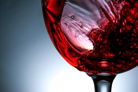 stream of wine being pouring into a glass closeup, wine, splashing, splash,の写真素材