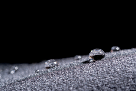 Drops of water close-up macro on velvet materialの写真素材