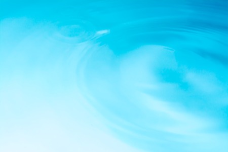 Blue water circle background, ripple water textureの写真素材