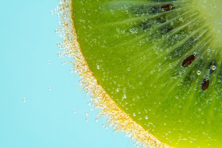 Kiwi water bubbles blue light background texture close-up macroの写真素材