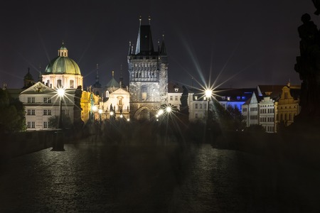 Charles Bridge in Prague in the evening, in the light of lanterns.の写真素材