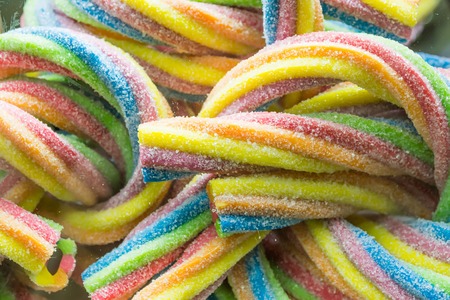 Background of multi-colored assorted jelly beans, chewing candies close-up.の写真素材
