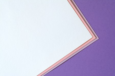 Multicolored paper background with trendy coral color of the year 2019. Abstract colorful paper background with soft light trendy coral color.の写真素材